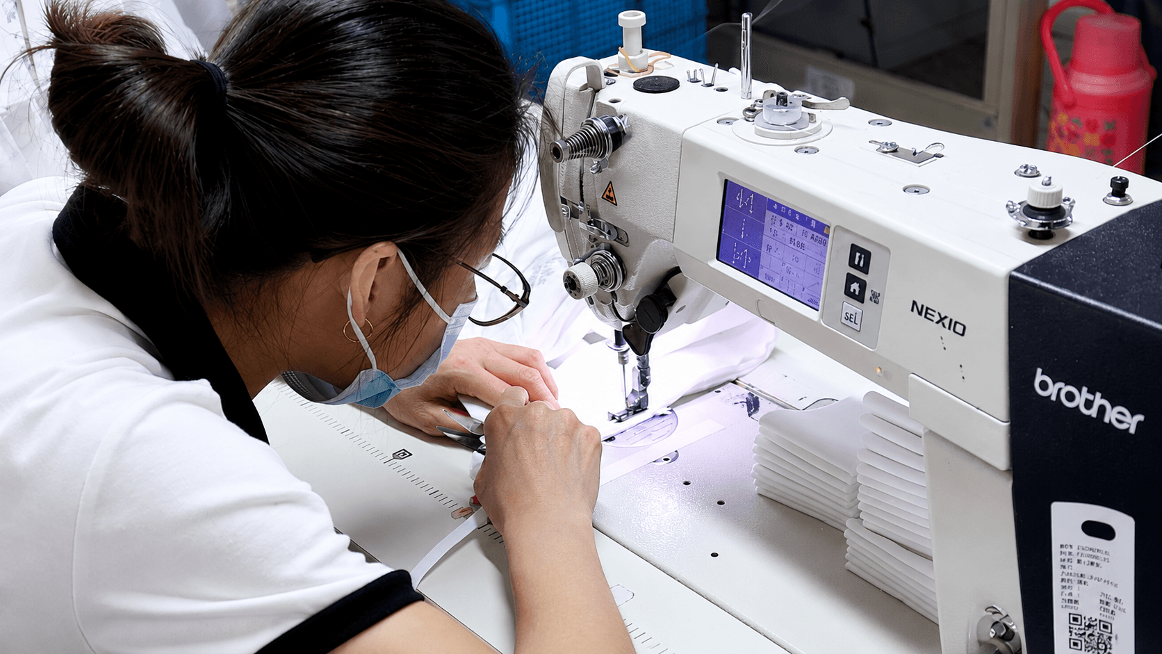 Coverenta sewing workshop with workers preparing apparel production on factory floor