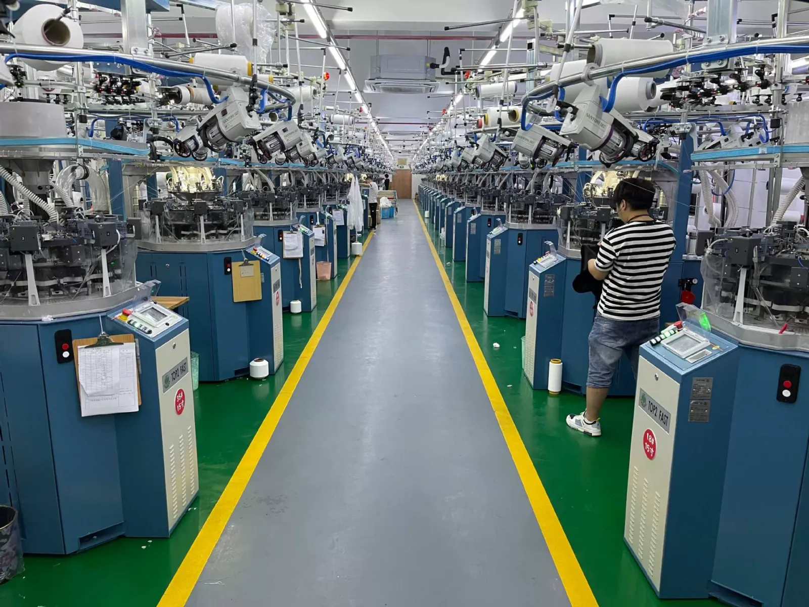 Rows of circular knitting machines in the Forthright factory